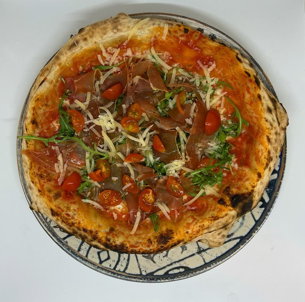 pizza con tomatitos